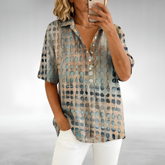 Woman wearing an elegant relaxed lightweight blouse with a soft, flowing drape