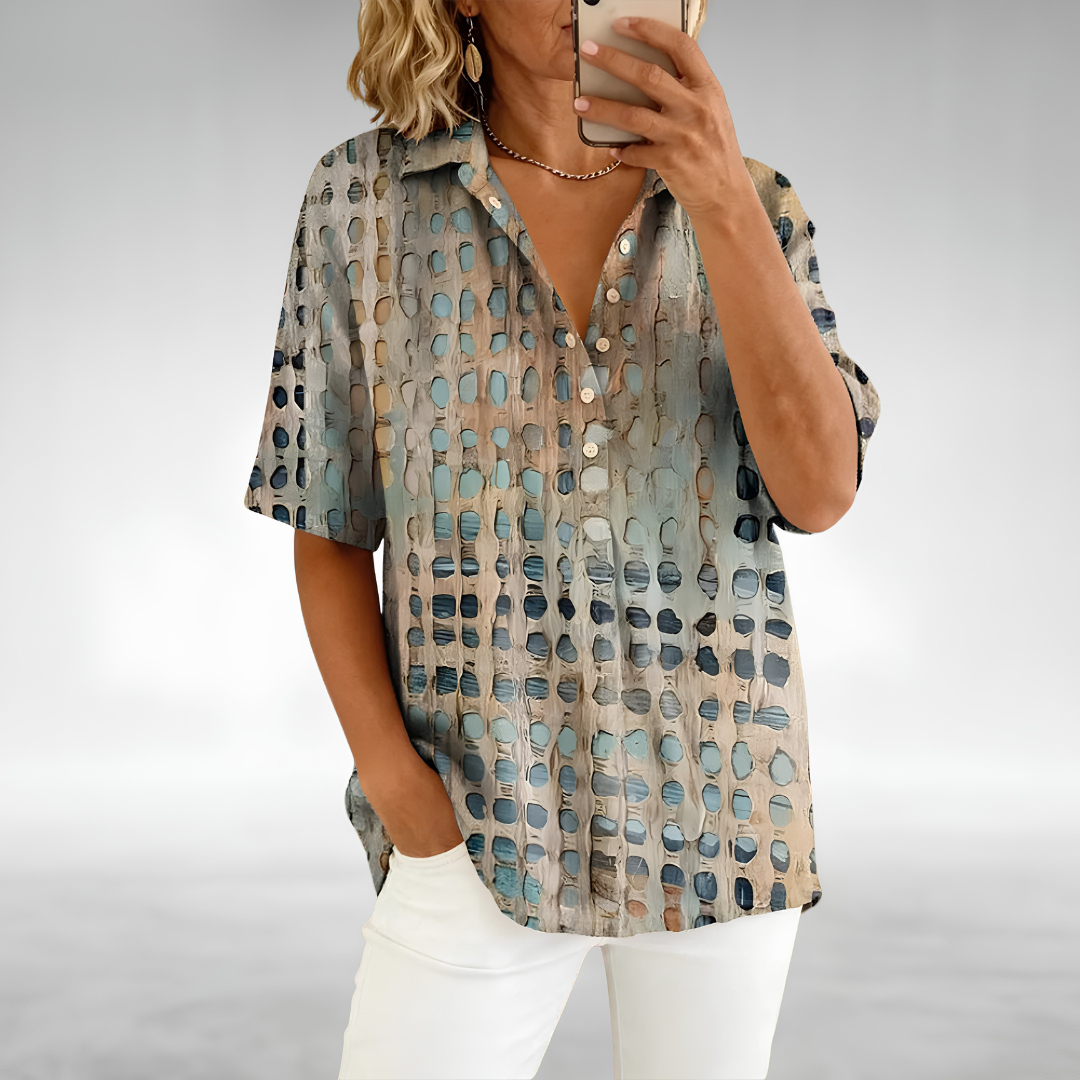 Woman wearing an elegant relaxed lightweight blouse with a soft, flowing drape
