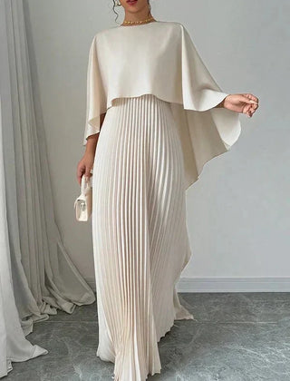 Elegant pleated cape maxi dress with flowing overlay and floor-length skirt