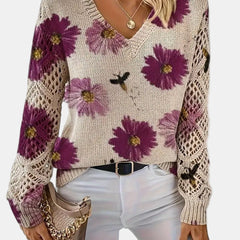 Women's floral knit V-neck sweater with open-knit sleeves and ribbed cuffs and hem