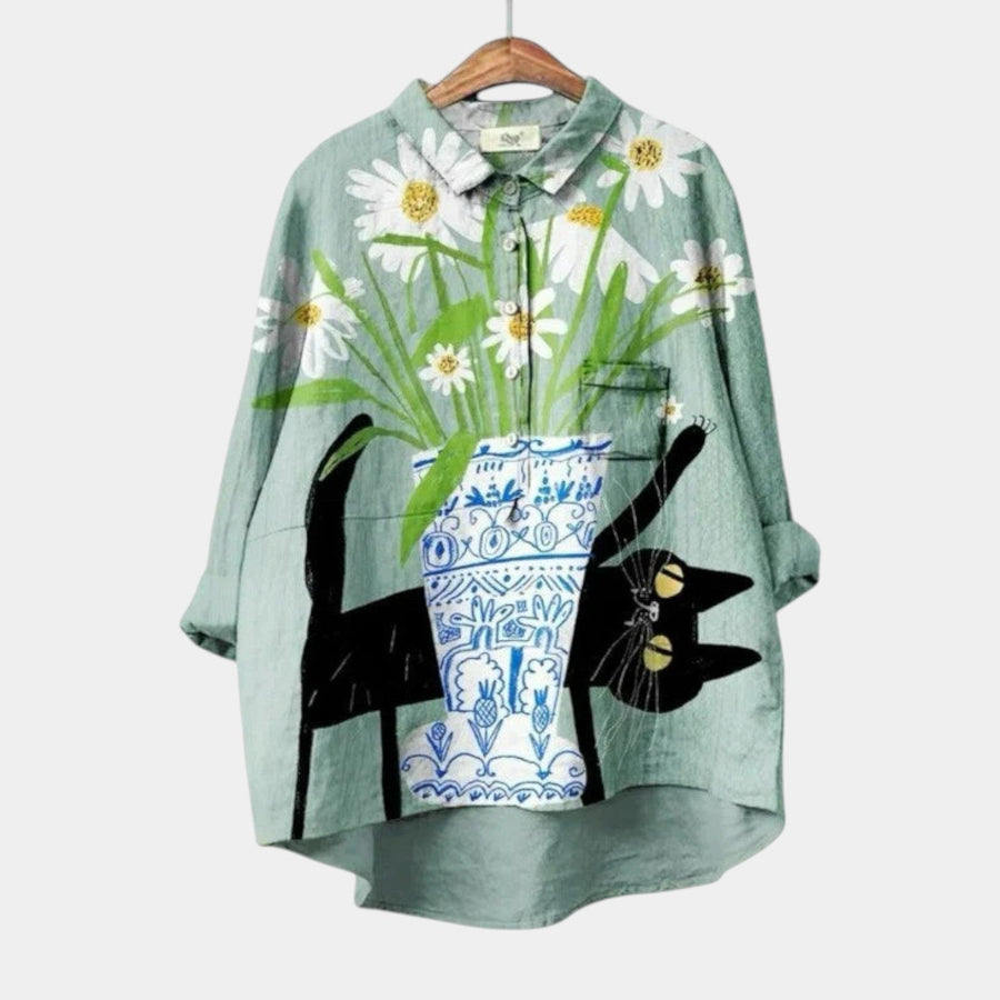 Woman wearing an elegant long-sleeve printed summer blouse that skims the body
