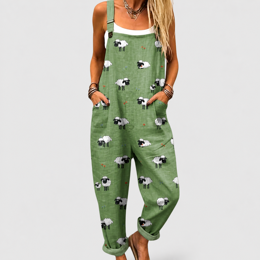 Woman wearing a printed wide-leg jumpsuit with adjustable straps