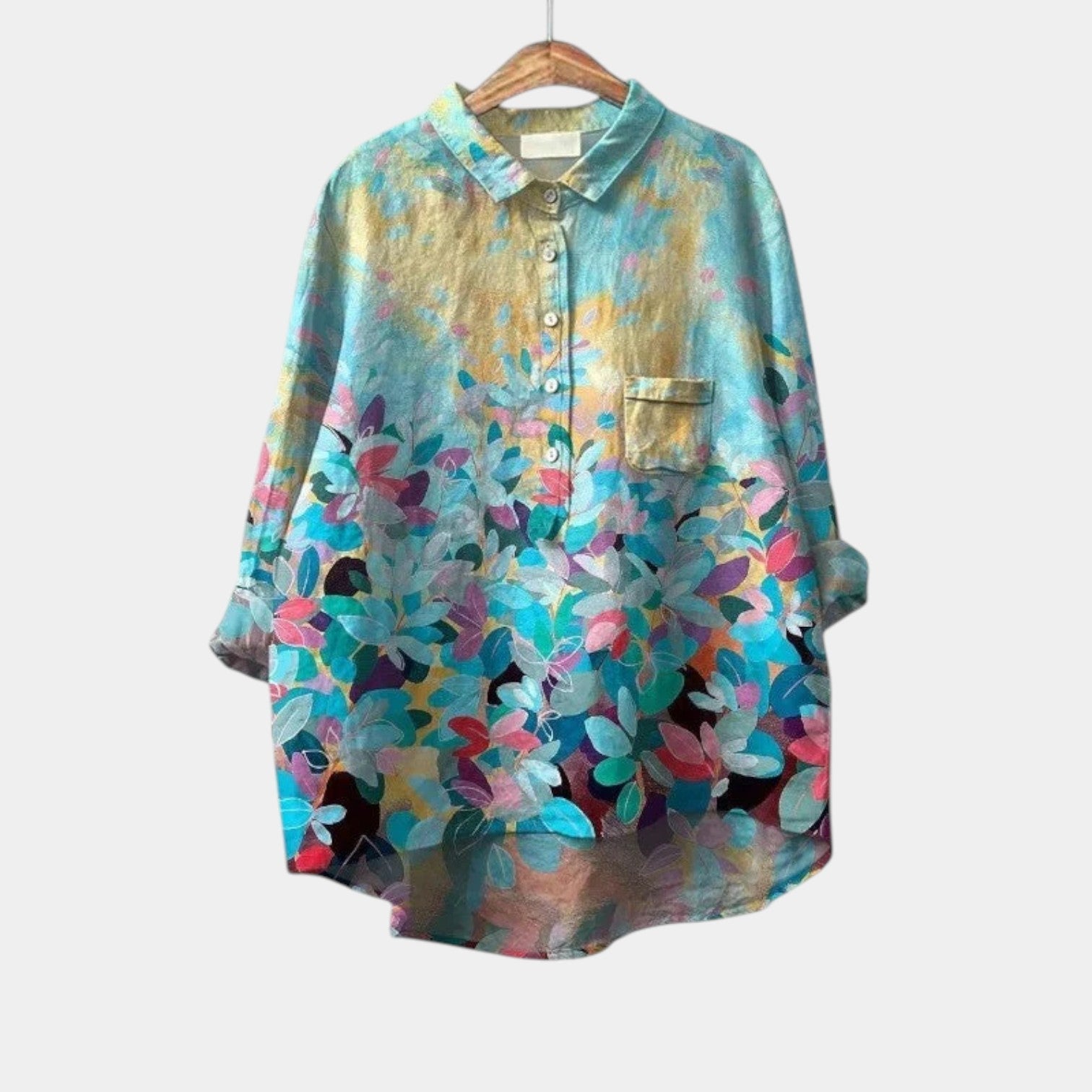 Woman wearing an elegant printed long-sleeve summer blouse in a relaxed fit