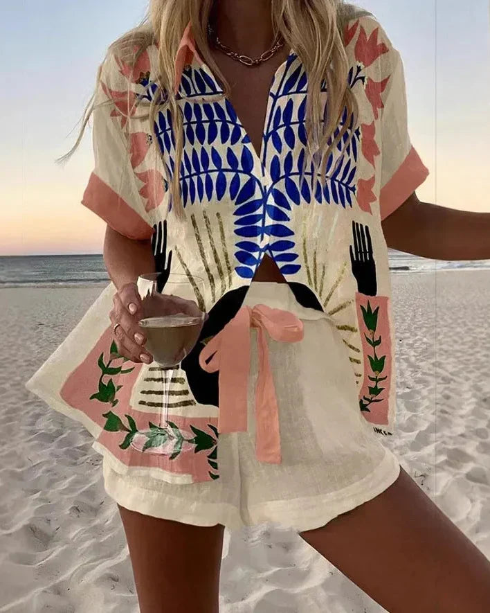 Coordinated summer set with cobalt blue leaf print button-up shirt and matching shorts