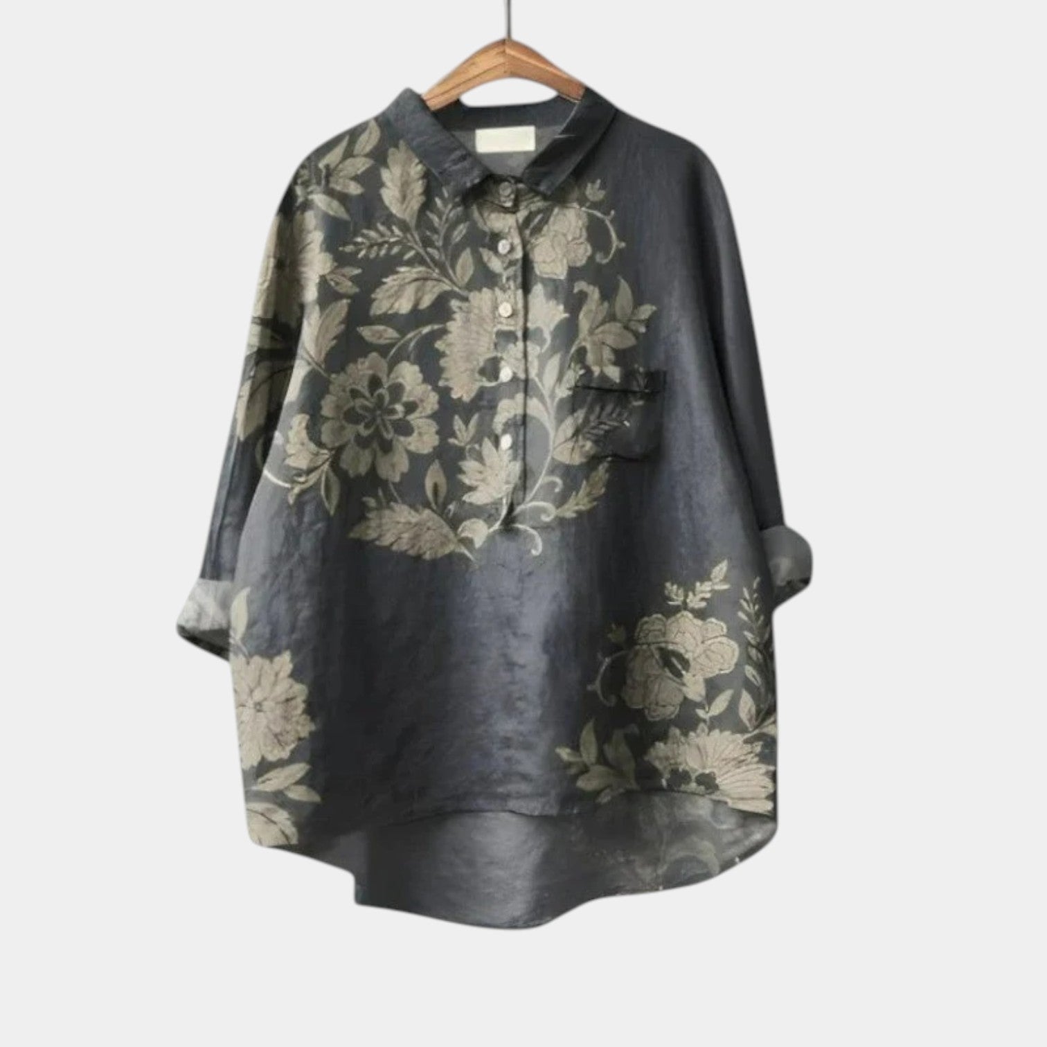 Woman wearing an elegant printed long-sleeve summer blouse styled with simple bottoms