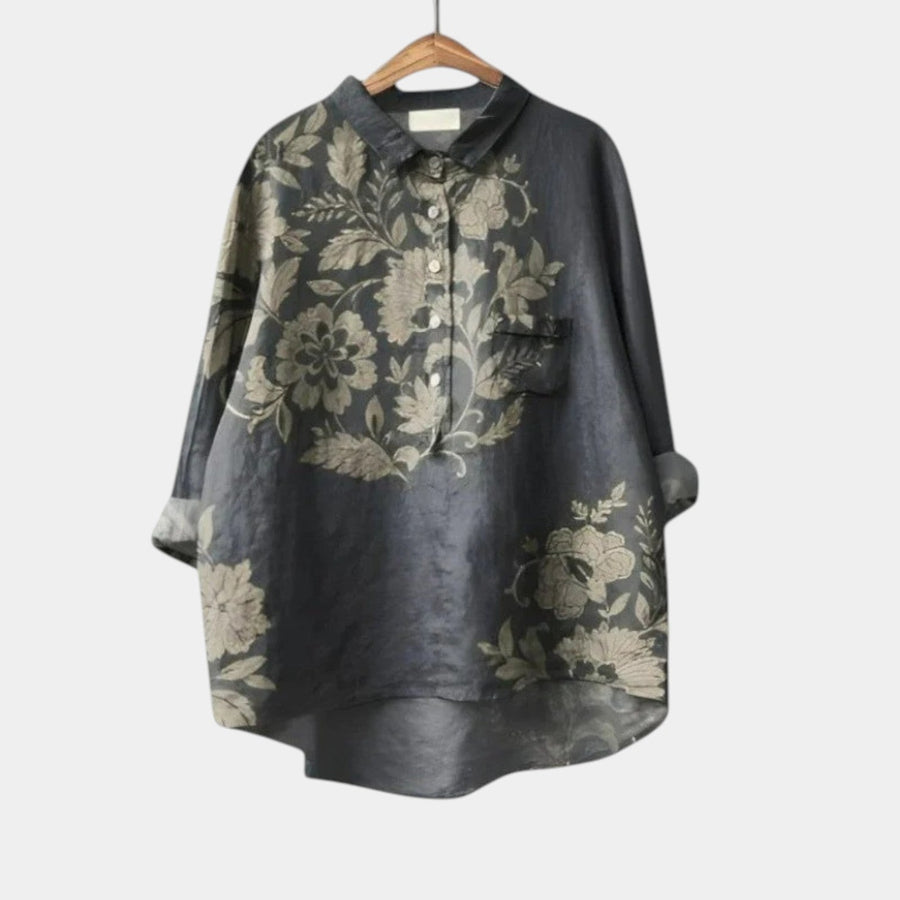 Woman wearing an elegant printed long-sleeve summer blouse styled with simple bottoms