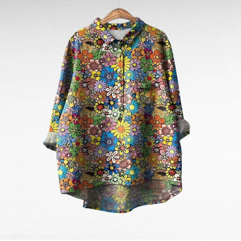 Woman wearing an elegant long-sleeve printed summer blouse with a relaxed, skimming fit