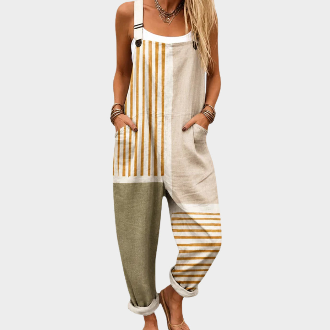 Woman wearing a printed wide-leg jumpsuit with adjustable straps