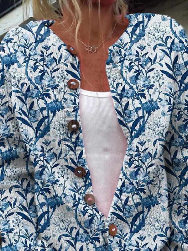 Blue and white vintage floral button-front cardigan with wooden buttons and long sleeves