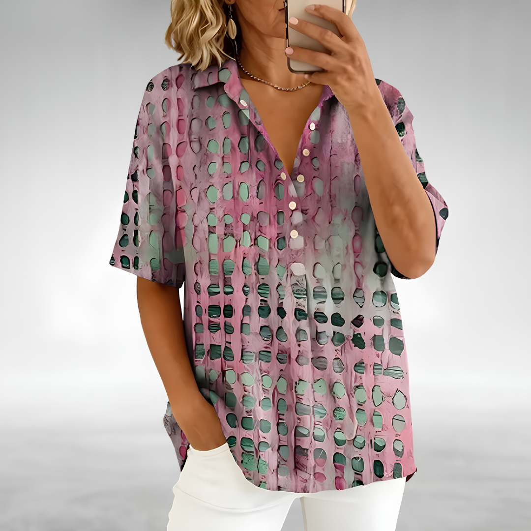 Woman wearing an elegant relaxed lightweight blouse with a soft, flowing drape
