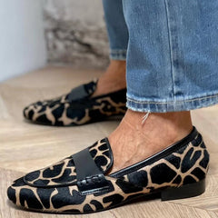 Animal print slip-on loafer with black strap detailing
