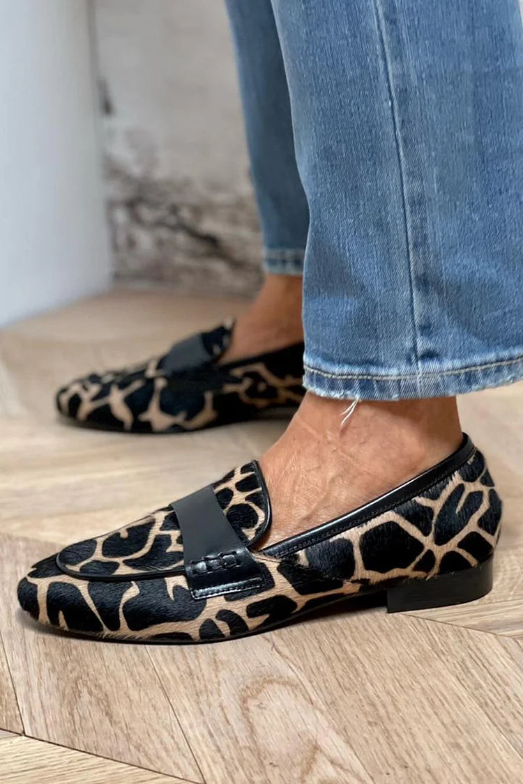 Animal print slip-on loafer with black strap detailing
