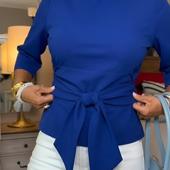 Woman wearing a tie waist flattering top with an adjustable soft waist tie
