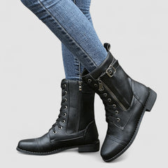 Buckled mid-calf combat boots with lace-up front and low block heel in brown, black and grey