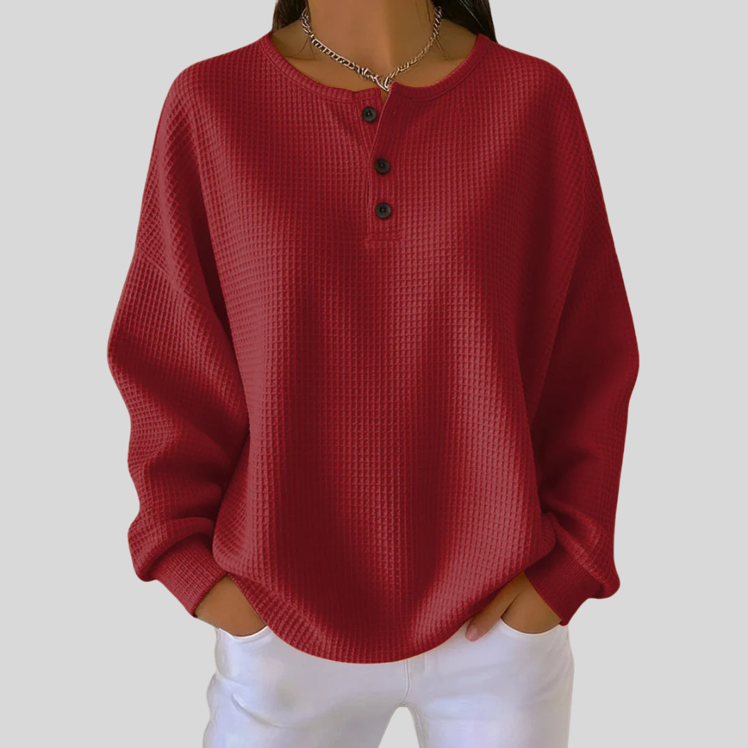 Relaxed-fit waffle-knit henley sweatshirt with button neckline, shown in several colours