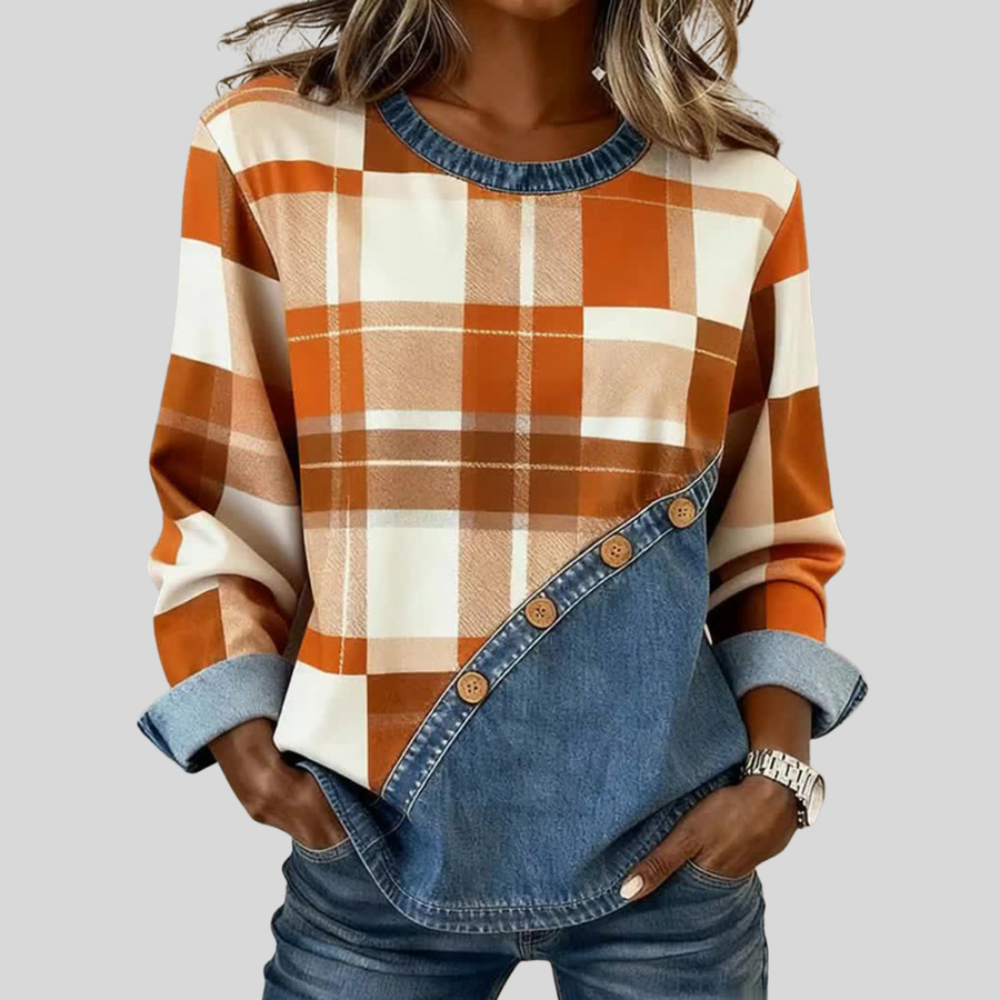 Warm-toned plaid patchwork pullover top with denim-style panel, crew neckline and wooden buttons