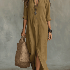Woman wearing a black button-front bohemian shirt maxi dress with a flowy silhouette