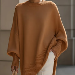 Oversized draped sweater with wide rounded neckline, ribbed cuffs and asymmetrical hem