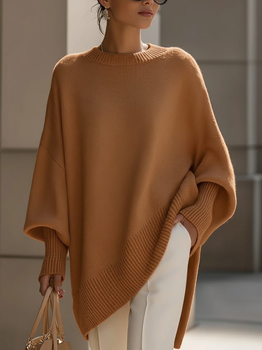 Oversized draped sweater with wide rounded neckline, ribbed cuffs and asymmetrical hem