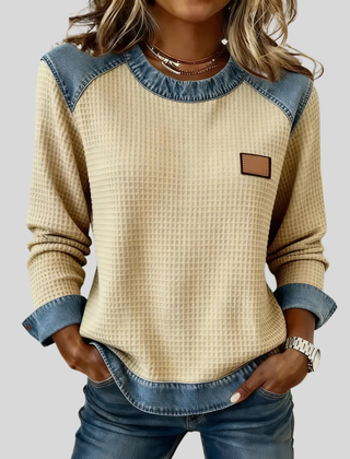 Waffle-knit sweatshirt with denim-inspired trim and a small chest patch, shown in several colours