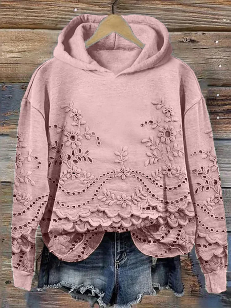 Women's floral eyelet pullover hoodie with structured hood and scalloped hem