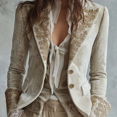 Ivory tailored blazer with gold-toned floral embroidery on the lapels and cuffs