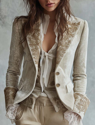 Ivory tailored blazer with gold-toned floral embroidery on the lapels and cuffs
