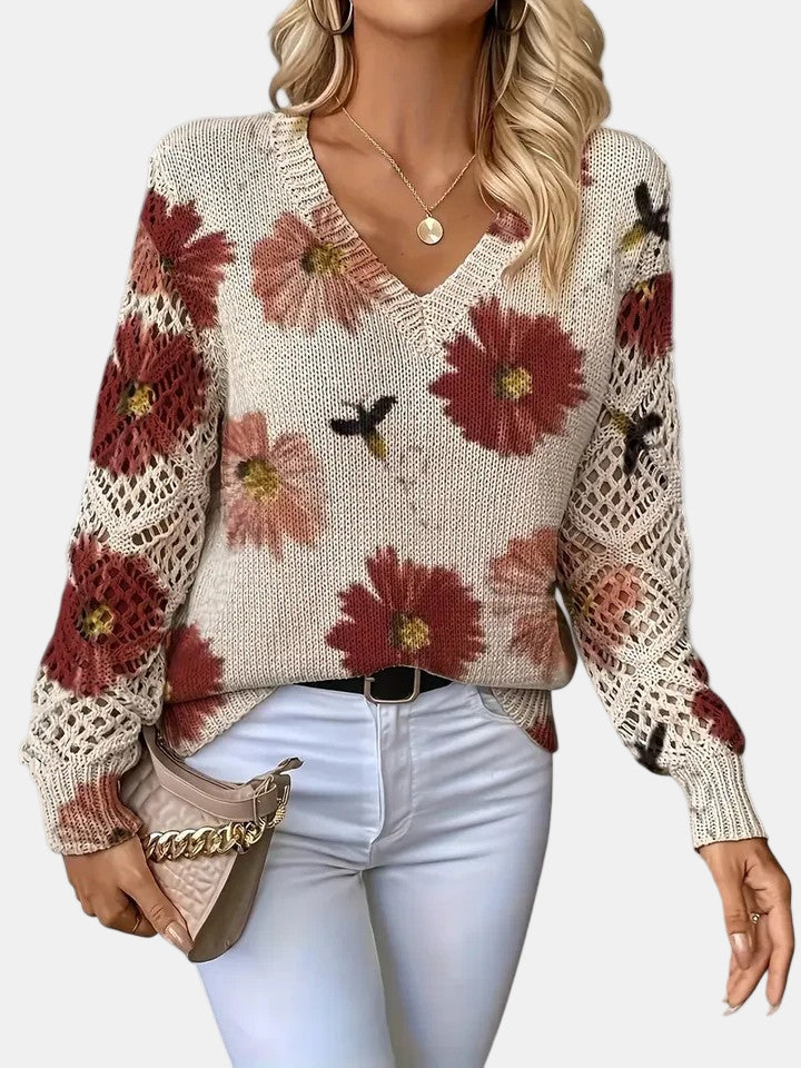 Women's floral knit V-neck sweater with open-knit sleeves and ribbed cuffs and hem