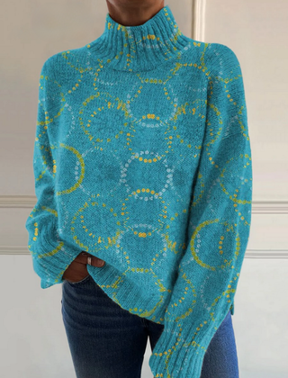 Turquoise turtleneck sweater with circle art print and relaxed fit