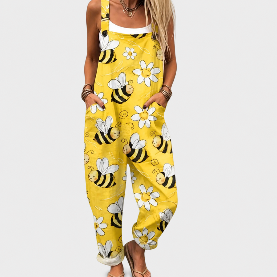 Woman wearing printed wide-leg overalls with adjustable straps and a relaxed silhouette