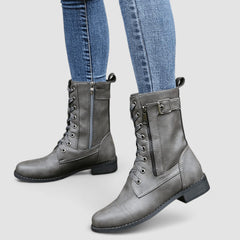 Buckled mid-calf combat boots with lace-up front and low block heel in brown, black and grey
