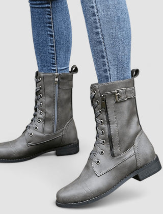 Buckled mid-calf combat boots with lace-up front and low block heel in brown, black and grey