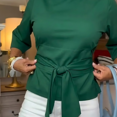 Woman wearing a tie waist flattering top with an adjustable soft waist tie