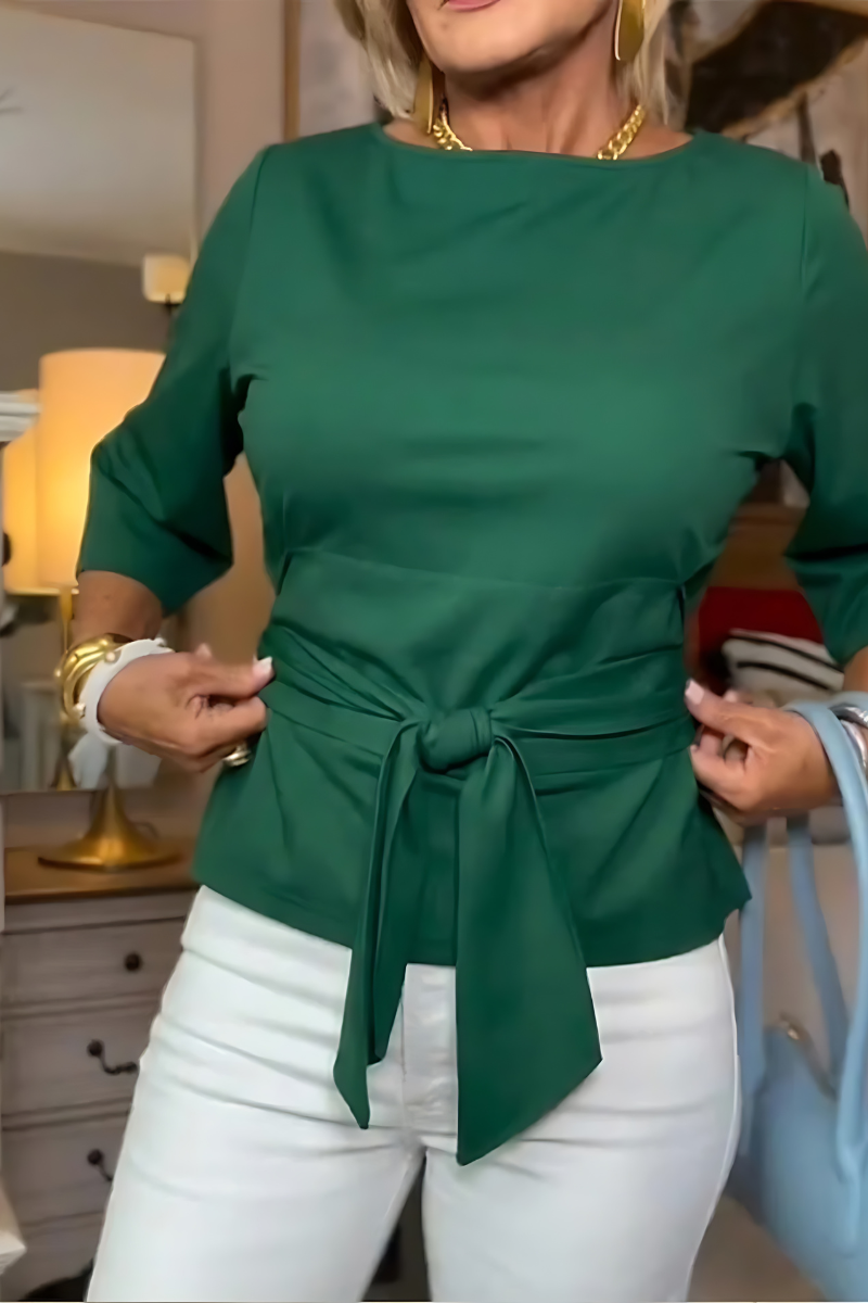 Woman wearing a tie waist flattering top with an adjustable soft waist tie