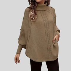 High-neck cable-knit sweater with ribbed turtleneck, shoulder buttons and relaxed oversized fit