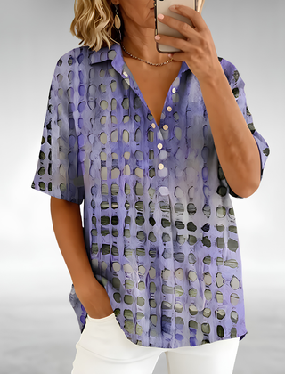 Woman wearing an elegant relaxed lightweight blouse with a soft, flowing drape