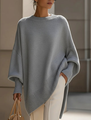 Oversized draped sweater with wide rounded neckline, ribbed cuffs and asymmetrical hem