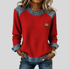 Waffle-knit sweatshirt with denim-inspired trim and a small chest patch, shown in several colours