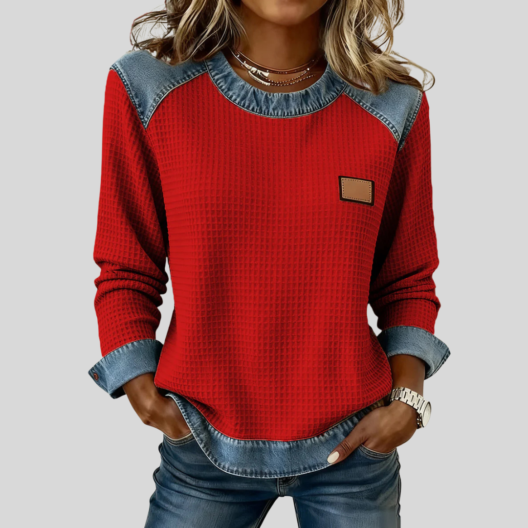 Waffle-knit sweatshirt with denim-inspired trim and a small chest patch, shown in several colours