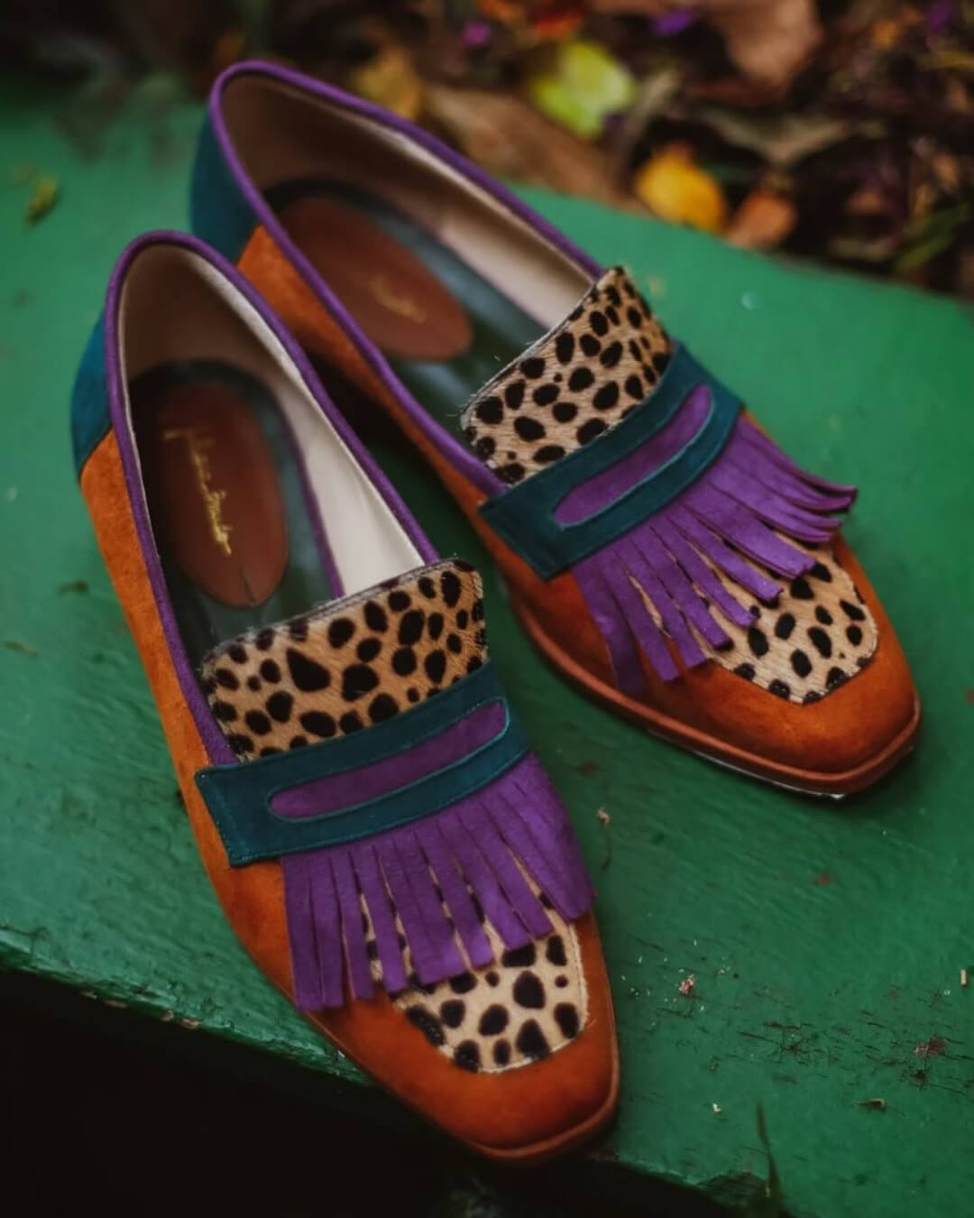 Brown animal print loafers with decorative fringes for women