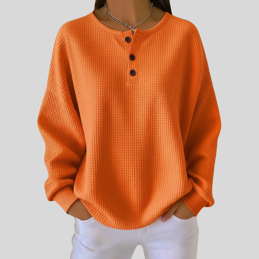 Relaxed-fit waffle-knit henley sweatshirt with button neckline, shown in several colours