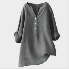 Woman wearing a relaxed cotton-linen V-neck blouse with soft draping