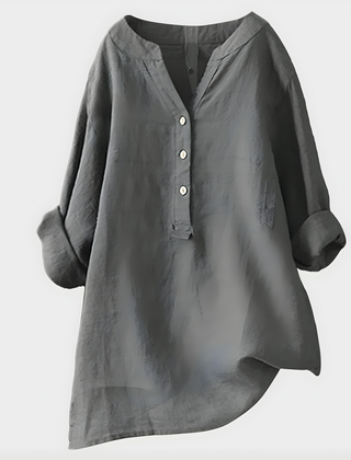 Woman wearing a relaxed cotton-linen V-neck blouse with soft draping