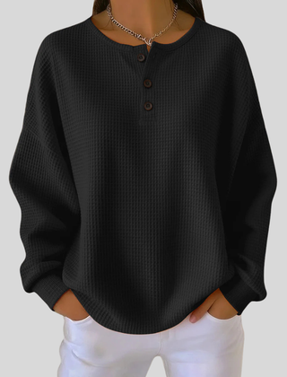 Relaxed-fit waffle-knit henley sweatshirt with button neckline, shown in several colours