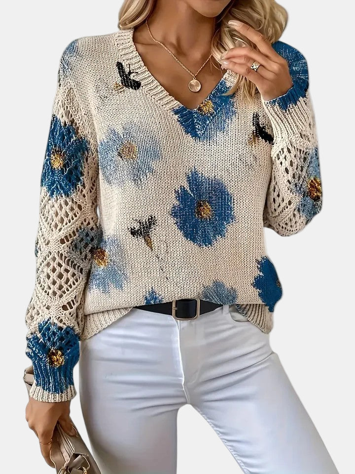 Women's floral knit V-neck sweater with open-knit sleeves and ribbed cuffs and hem