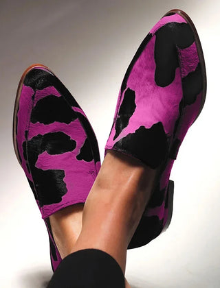 Statement animal-print loafers in a classic slip-on silhouette, shown in fuchsia and green
