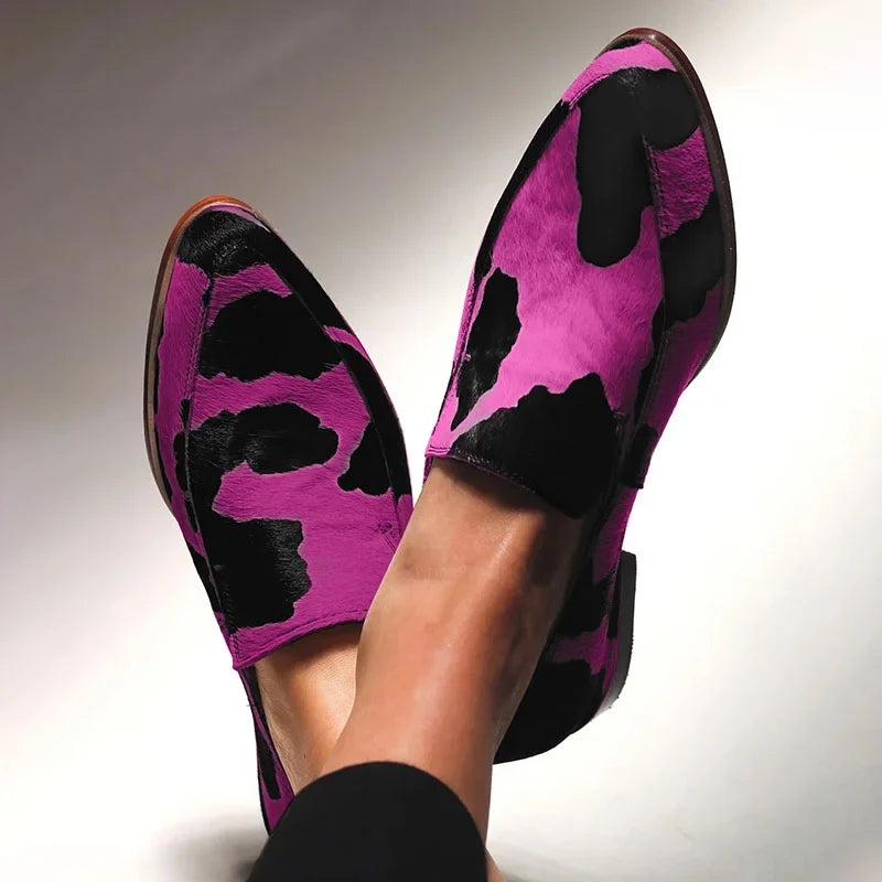 Statement animal-print loafers in a classic slip-on silhouette, shown in fuchsia and green