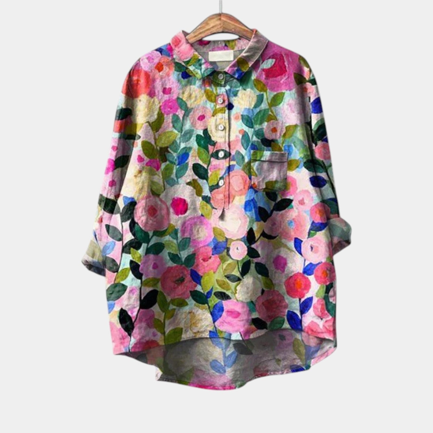 Woman wearing an elegant printed long-sleeve summer blouse in a relaxed, flattering cut