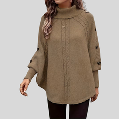 High-neck cable-knit sweater with ribbed turtleneck, shoulder buttons and relaxed oversized fit