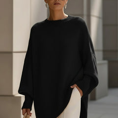 Oversized draped sweater with wide rounded neckline, ribbed cuffs and asymmetrical hem